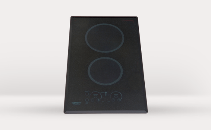 12 Inch Cooktop  Simplify the way you cook with precise temperature control and consistent results. Kenyon Radiant Cooktops. Uniform surface with spring-loaded burners underneath the glass. The special design directs heat up through the ceramic glass providing efficient cooking. Powerful burners ensure consistent level of heat for exceptional boiling, simmering, and melting. Available in digital and knob controls. Designed for budding chefs who love to multitask, this two-burner model is a chic addition to any kitchen. The sleek, black ceramic glass surface not only elevates your kitchen’s aesthetic but also ensures effortless maintenance with its durable, easy-to-clean design. Its sharp stainless steel graphics and contemporary knobs make it ideal for any cooking area. Upgrade your kitchen with the Kenyon Cooktop and experience a seamless blend of style, safety, and superior cooking performance. Kenyon Induction Cooktops-The most efficient form of cooking available. The heat is generated by an electromagnetic field, directly on the bottom of the cookware producing heat immediately. Easy-to-clean surface generates heat only to the cookware so boil-overs can’t burn onto the glass top. Choose from the assorment that meet your specific cooking and installation needs